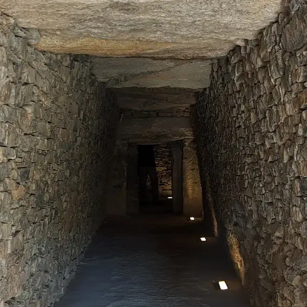 Daylight entering the stone corridor of a 5,000-year-old dolmen in Antequera, Spain