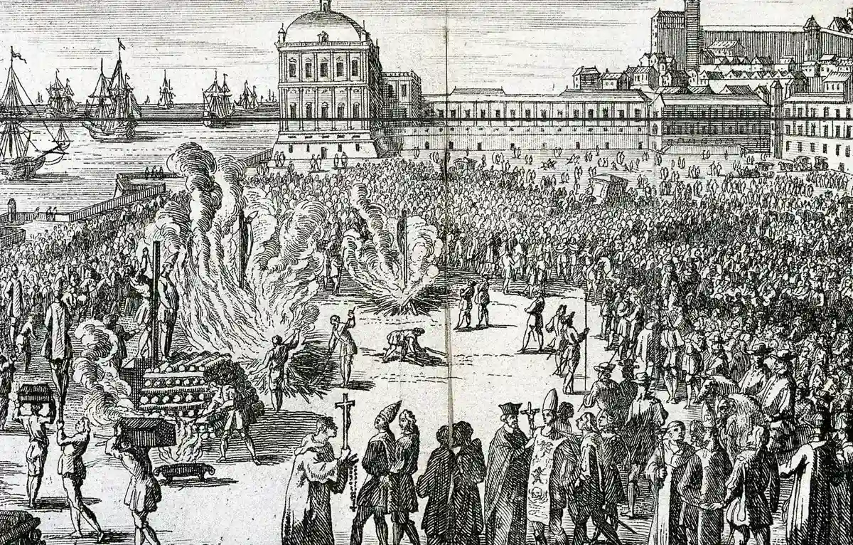 18th-century engraving of an Inquisition auto-da-fé in Lisbon's Terreiro do Paço, with crowds watching heretics burned at the stake